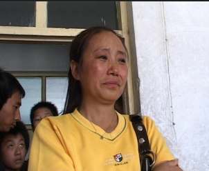 李利娟19年收养72名弃婴每天为22个孩子做早饭李利娟背景照片